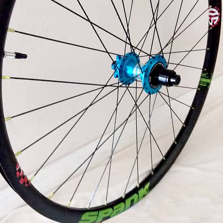 custom mountain bike wheel with Project 321 hub and Spank Rim